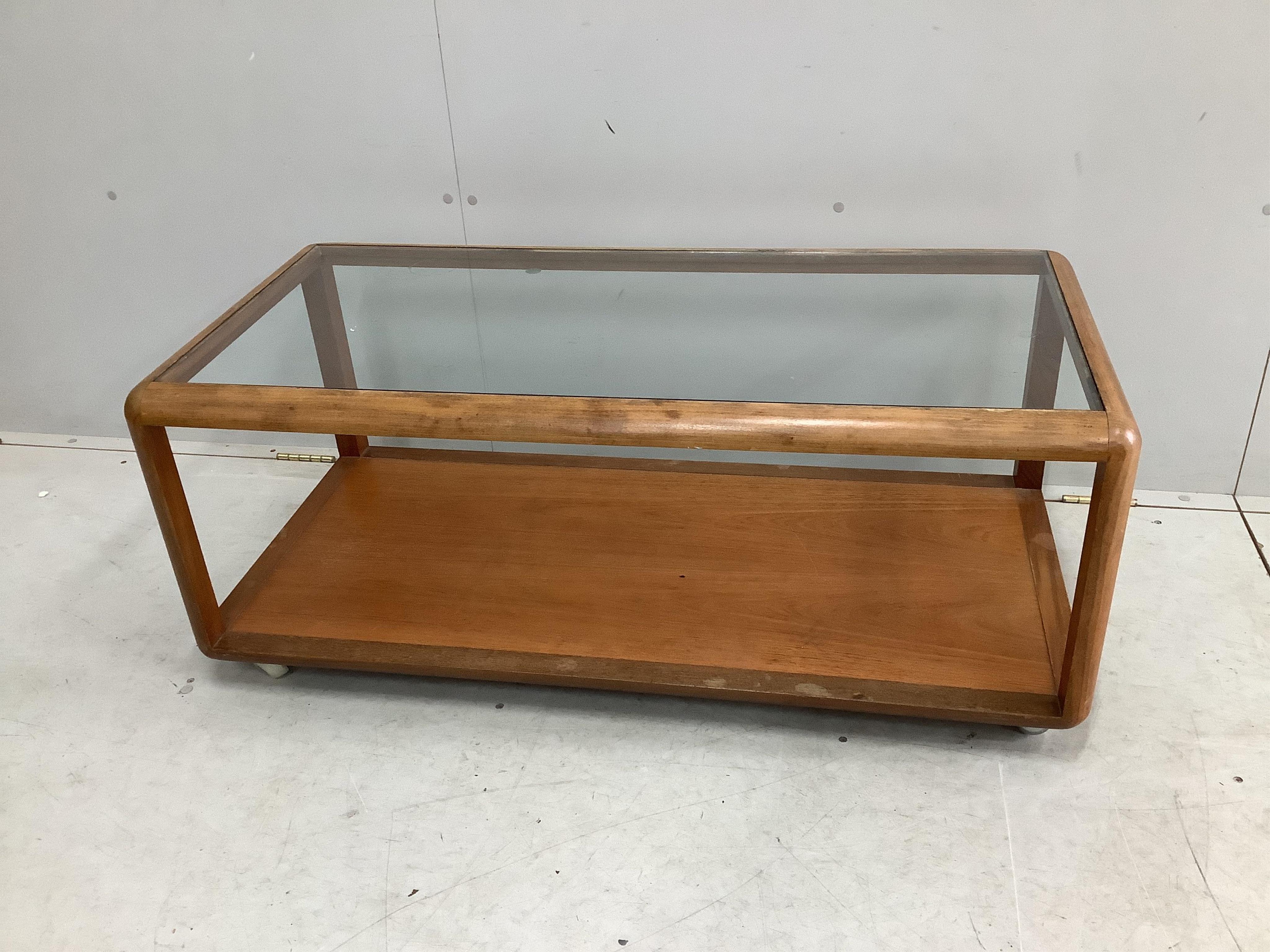 A mid century rectangular G plan glass top coffee table, width 110cm, depth 54cm, height 45cm. Condition - fair